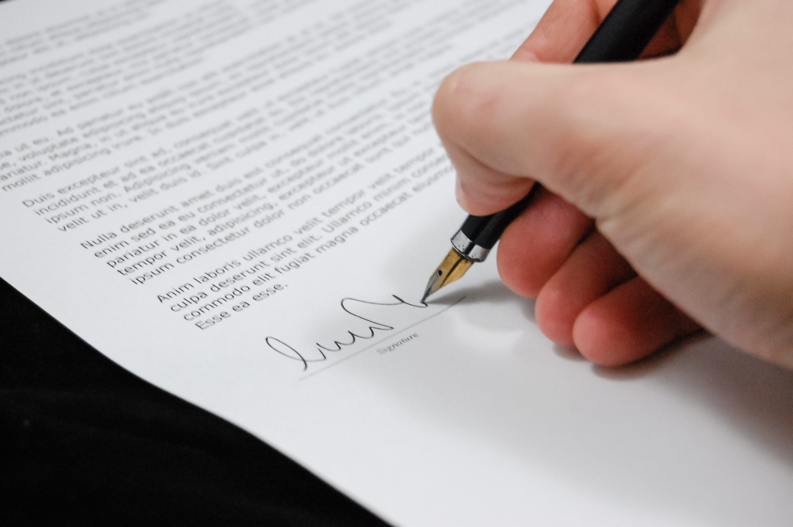 hand signing a document