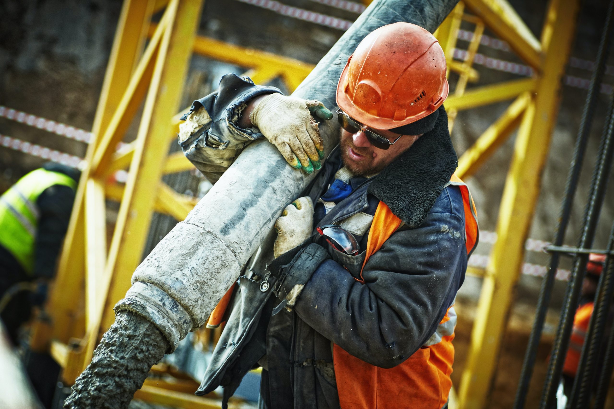 construction worker carrying materials