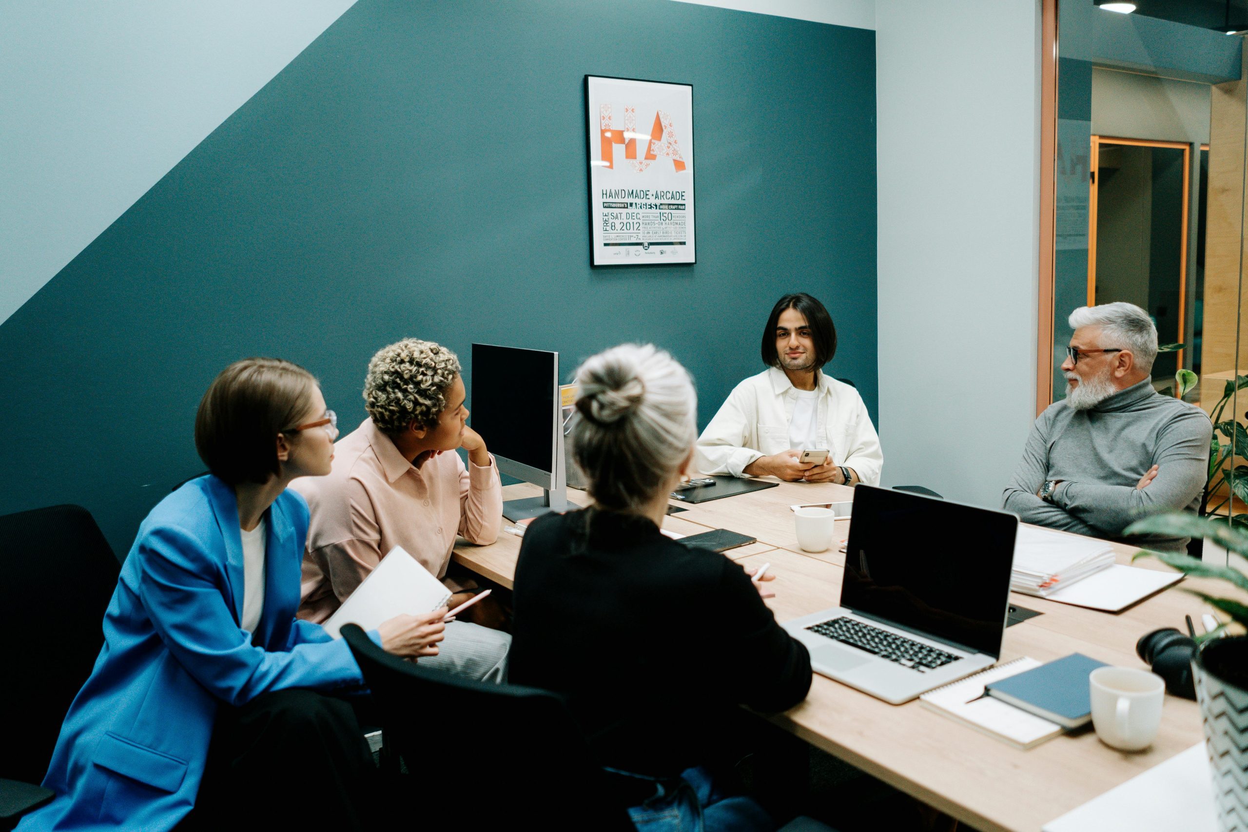 employers and employees having a meeting