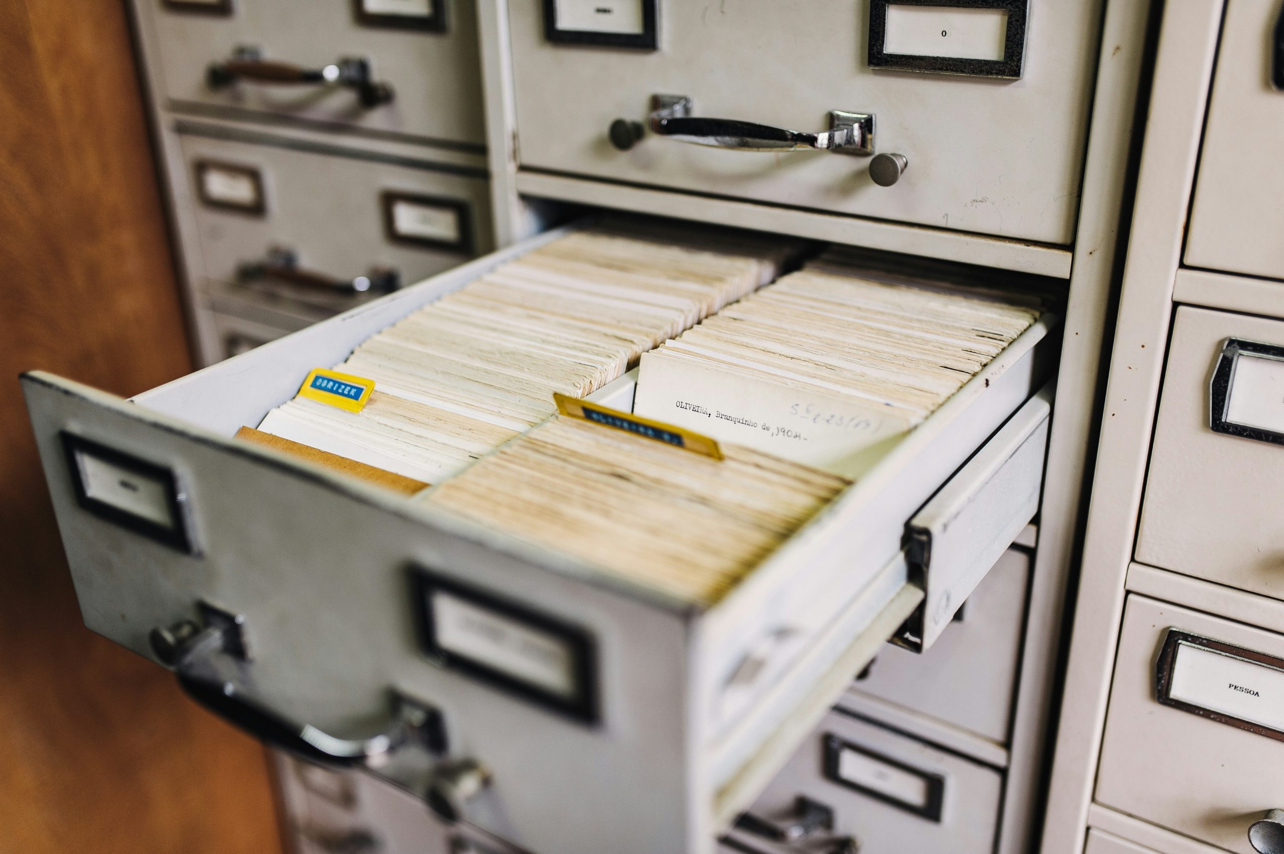 Open filing cabinet full of documents.